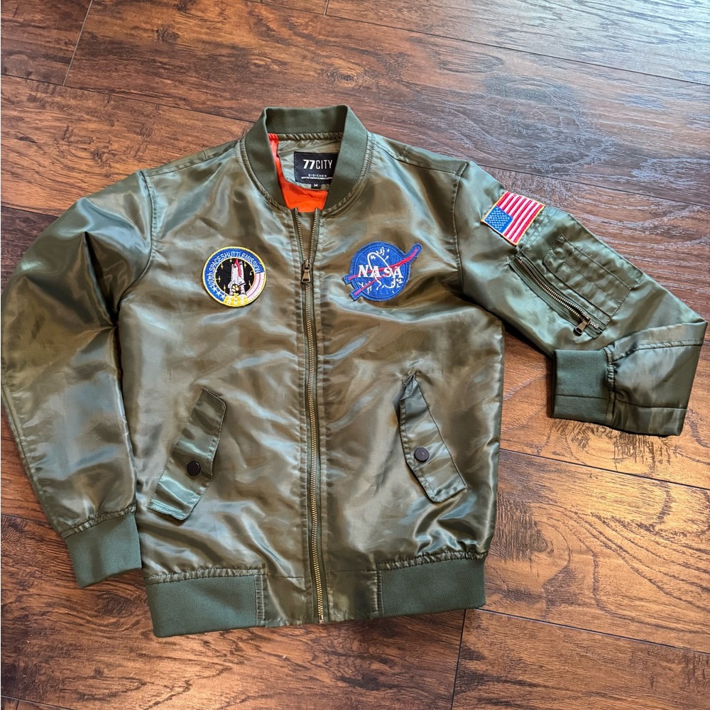 100th SPACESHUTTLE EMISSION lightweight Army green jacket.